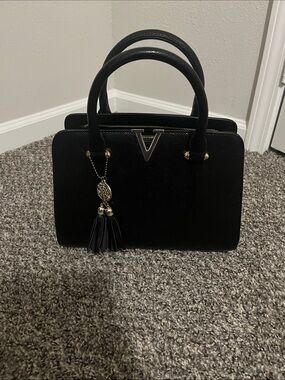 Structured Black Top-Handle Satchel with Tassel Charm